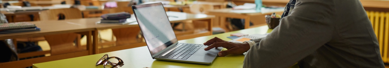 close-up of hands using a laptop
