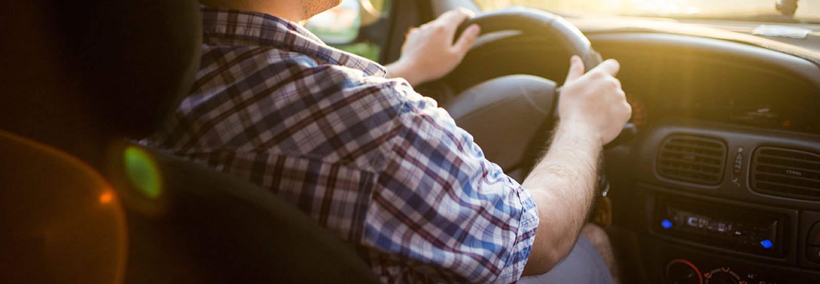 Man driving a vehicle.