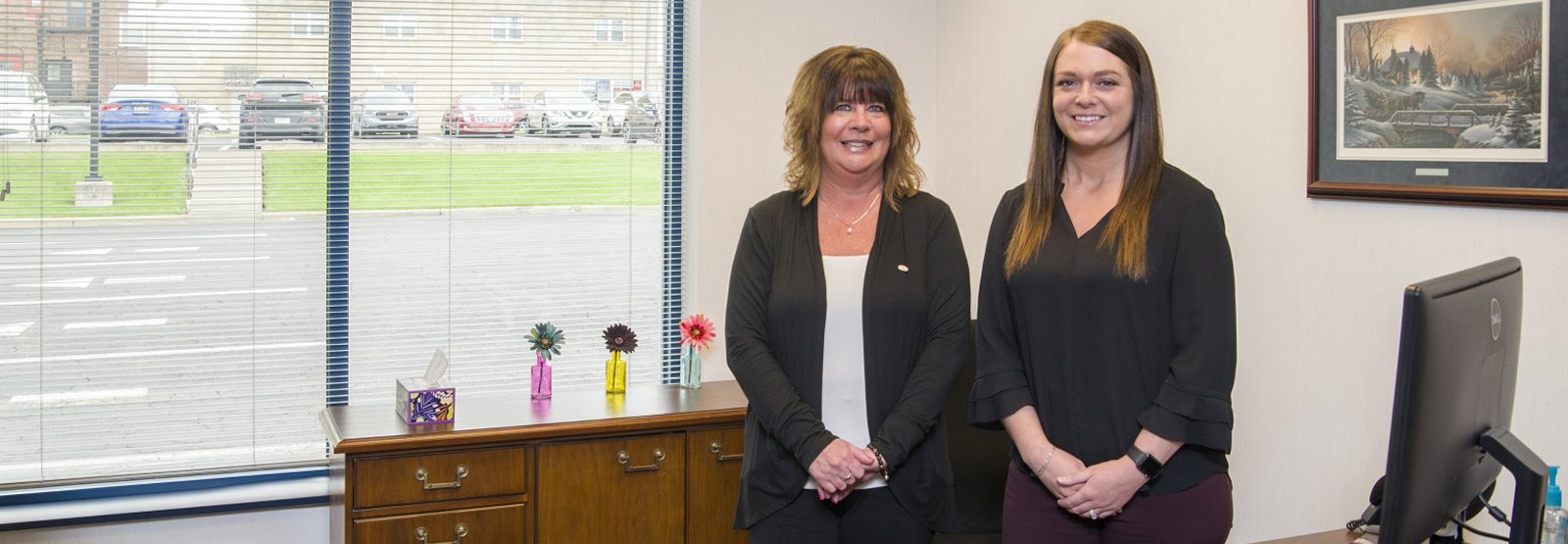 First Federal Savings Bank of Angola staff taking a picture together in office and smiling